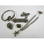 Vintage white metal and other costume jewellery, including a marcasite bow brooch, a curb link charm