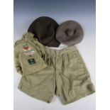 A group of vintage Boy Scout clothing and headdress