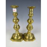 A pair of Victorian brass candlesticks