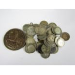 A quantity of silver British coinage including a 1935 George V silver jubilee crown and threepenny