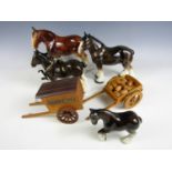 Four porcelain shire horses and two small carts