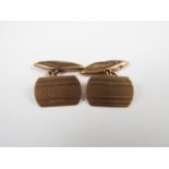 A pair of 9ct gold cuff links, with engine turned decoration, 3.7g