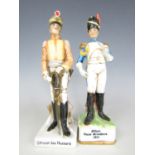 A pair of continental porcelain military figurines