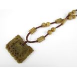 A Chinese jade pendant necklace