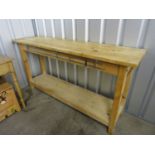 A contemporary pine kitchen preparation bench