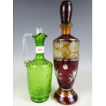 A 19th Century ruby and amber etched glass decanter together with an emerald green glass jug