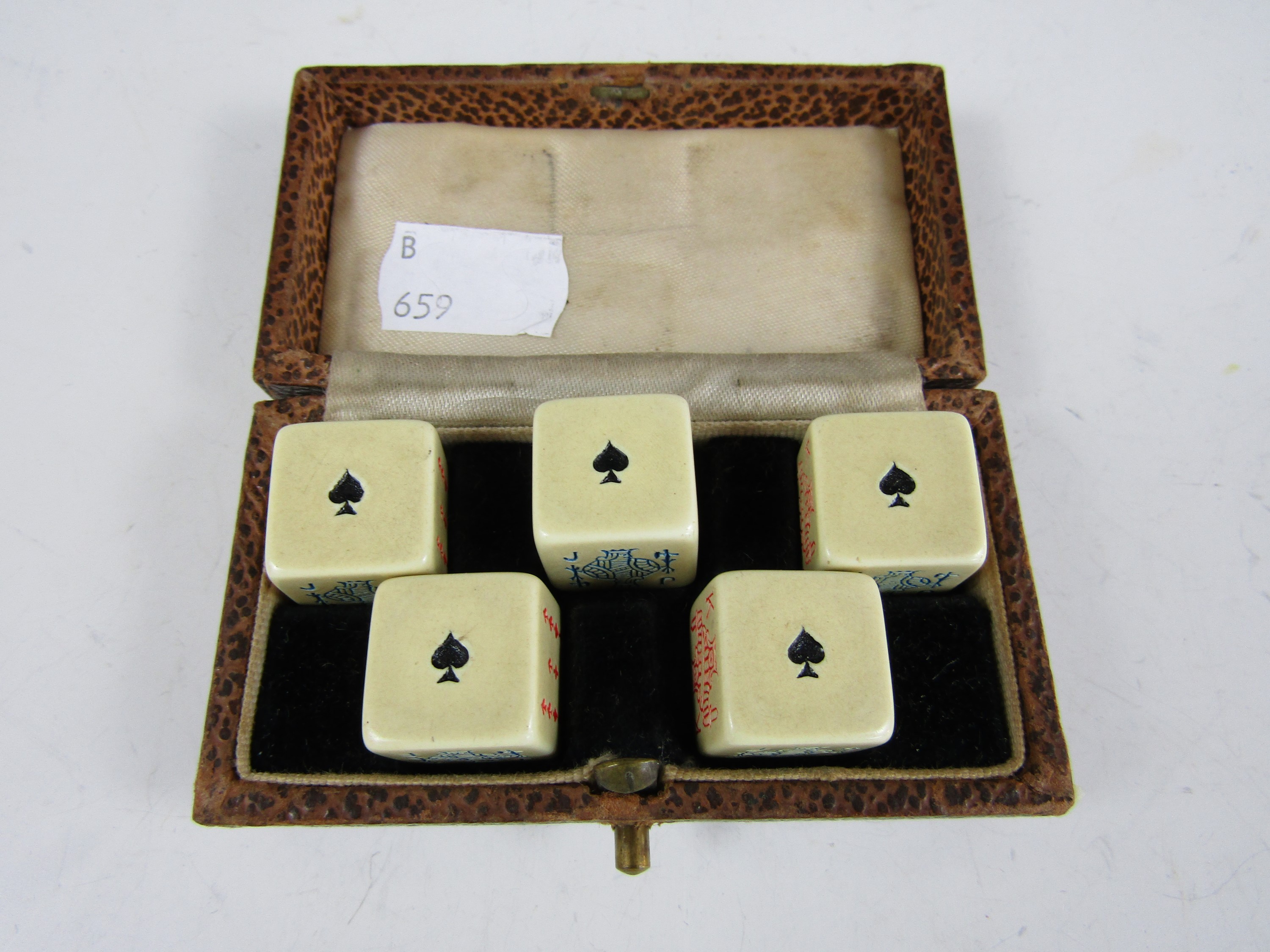 A vintage cased set of poker dice