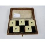 A vintage cased set of poker dice