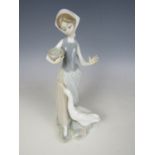 A Lladro figurine of a girl and a goose