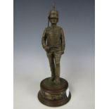 A cold cast bronze sculpture of a Royal Horse Artillery trooper, 26 cm high
