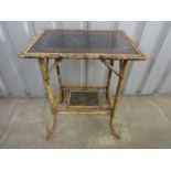 A 19th Century black lacquered bamboo table