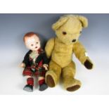 A vintage mohair Teddy bear with straw filled body and movable joints, together with a mid 20th