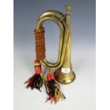 A brass bugle with tassels