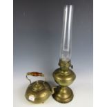 A brass oil lamp together with a brass kettle