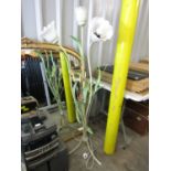 A contemporary wrought metal work standard lamp in the form of three flower stems