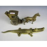 A brass horse and carriage together with a novelty brass crocodile nut cracker