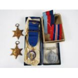 Three Second World War military campaign medals and an Association of Conservative Clubs