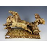 A modern resin sculpture of a Roman Centurion riding a chariot