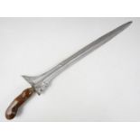 A Malayan kris / dagger, having carved wooden handle and blade with pronounced pamor and chinth-like