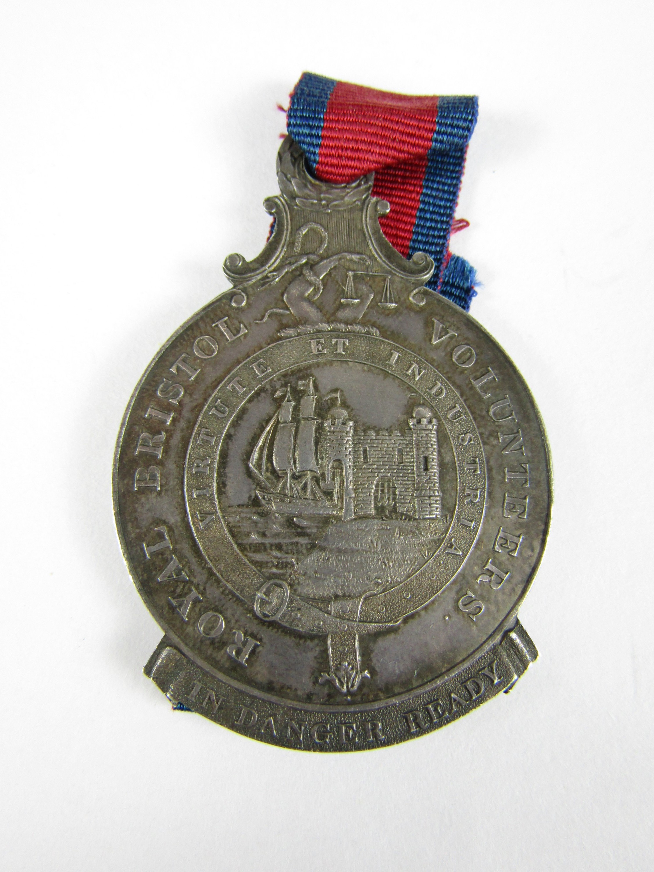 An 1814 Royal Bristol Volunteers medal, obverse the arms of the city of Bristol within an annulus