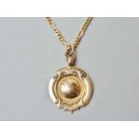 A George V 9ct gold prize fob medallion on a 9ct gold figaro link neck chain, 8.5g