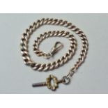 A yellow-metal graded curb-link watch chain with swivel, and gilt metal watch key, stamped 9ct,