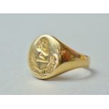 A gentleman's 18ct gold signet ring, with intaglio armorial crest, 7.1g