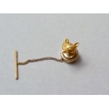 A 9ct gold tie tack in the form of a fox's mask