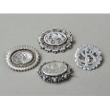 Four Victorian and later silver brooches, one engraved with a view of Brechin Cathedral, three