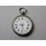 A late 19th Century lady's silver fob watch, having a gilt-enriched enamelled face