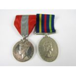 A Civil Defence Long Service medal and an Imperial Service medal the latter to James Jeremiah