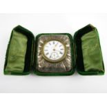 A late Victorian silver-cased travelling boudoir timepiece, having a French movement with enamel