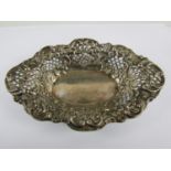 A Victorian silver bon bon dish, of everted lenticular shape, densely repousse moulded with C