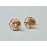 A pair of Chinese yellow metal character stud earrings, 1g