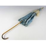 A late 19th / early 20th Century lady's sun parasol with bamboo handle, in turquoise blue cotton