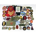 A quantity of post-War British military cloth insignia