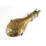 A 19th Century copper powder flask by Bartram & Co, the body embossed in an elaborate baroque design