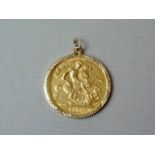 A 1958 gold sovereign, in a fine 9ct gold pendant mount, 8.9g total weight