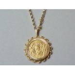 A 1910 gold sovereign, in a 9ct gold pendant mount, on a fancy 9ct gold belcher link neck chain,