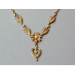 A late 19th Century high-carat yellow metal, split seed pearl and diamond necklace, with central