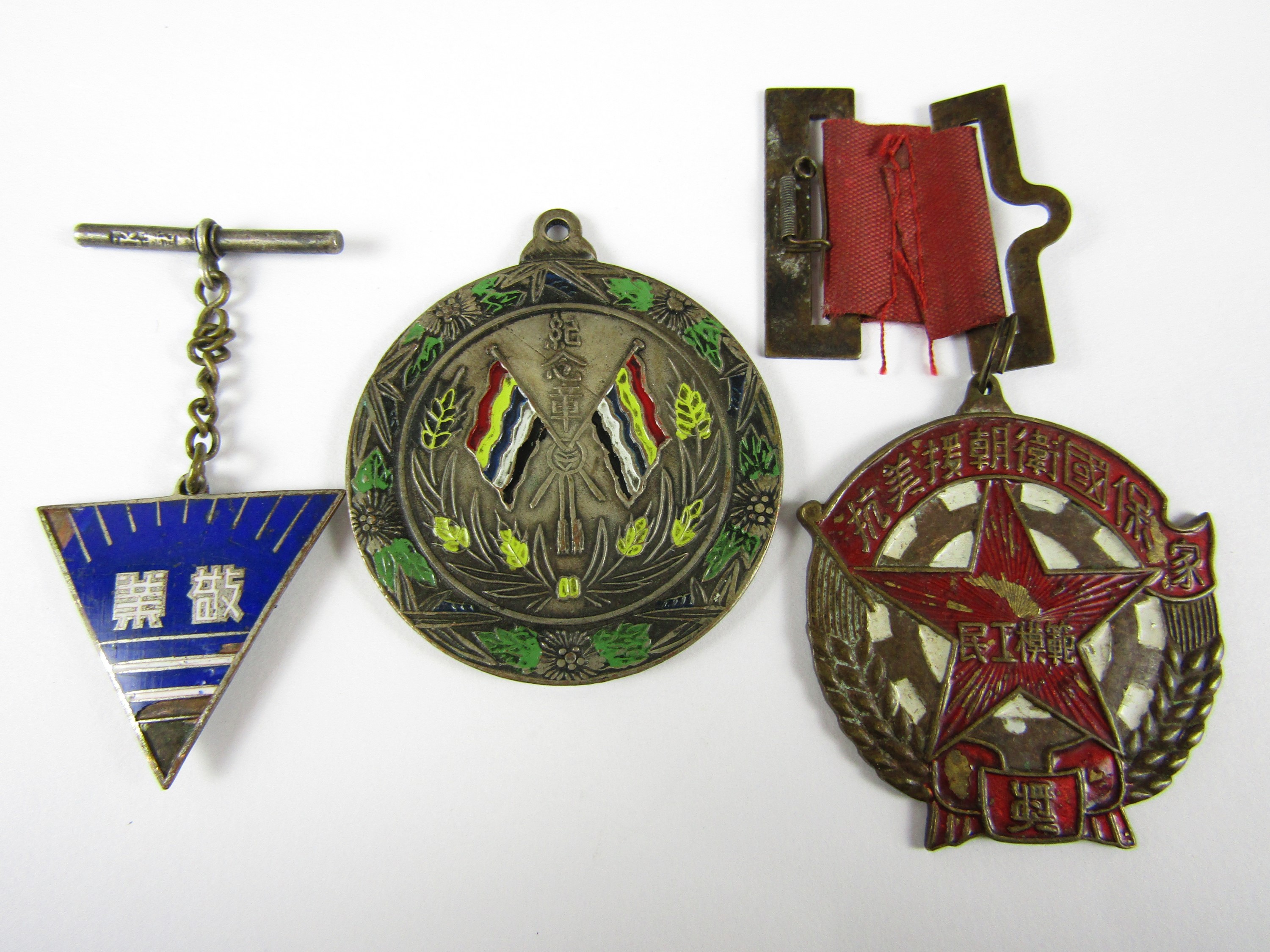 Three Communist Chinese medals