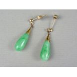 A pair of jade and yellow-metal pendant stud earrings, tests as gold
