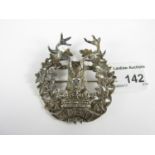 A Gordon Highlanders officers' white metal cap badge, bearing the retailer's plaque of Scott Adie