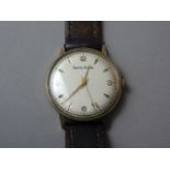 A 1960s gentleman's 9ct gold cased Smith's Astral long service wristwatch, with silvered face and