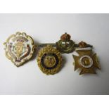 Four various military sweetheart brooches including a yellow metal Argyll and Sutherland Highlanders