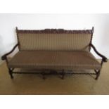 A 1920s carved and upholstered late 17th Century influenced oak settee, 190 cm