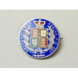 A Victorian 1884 enamelled silver halfcrown brooch