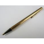 A George V 9ct gold propelling pencil, with reeded decoration and engraved monogram, London, 1932