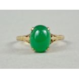 A 9ct gold and green agate dress ring, the stone claw and crown set, above reticulated fleur-de-