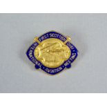 A 1910 First Scottish International Aviation Meeting enamelled lapel badge